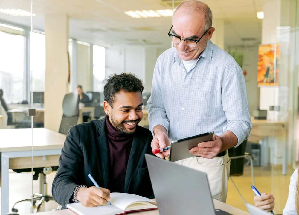 A manager and a new team member in a one-to-one conversation
